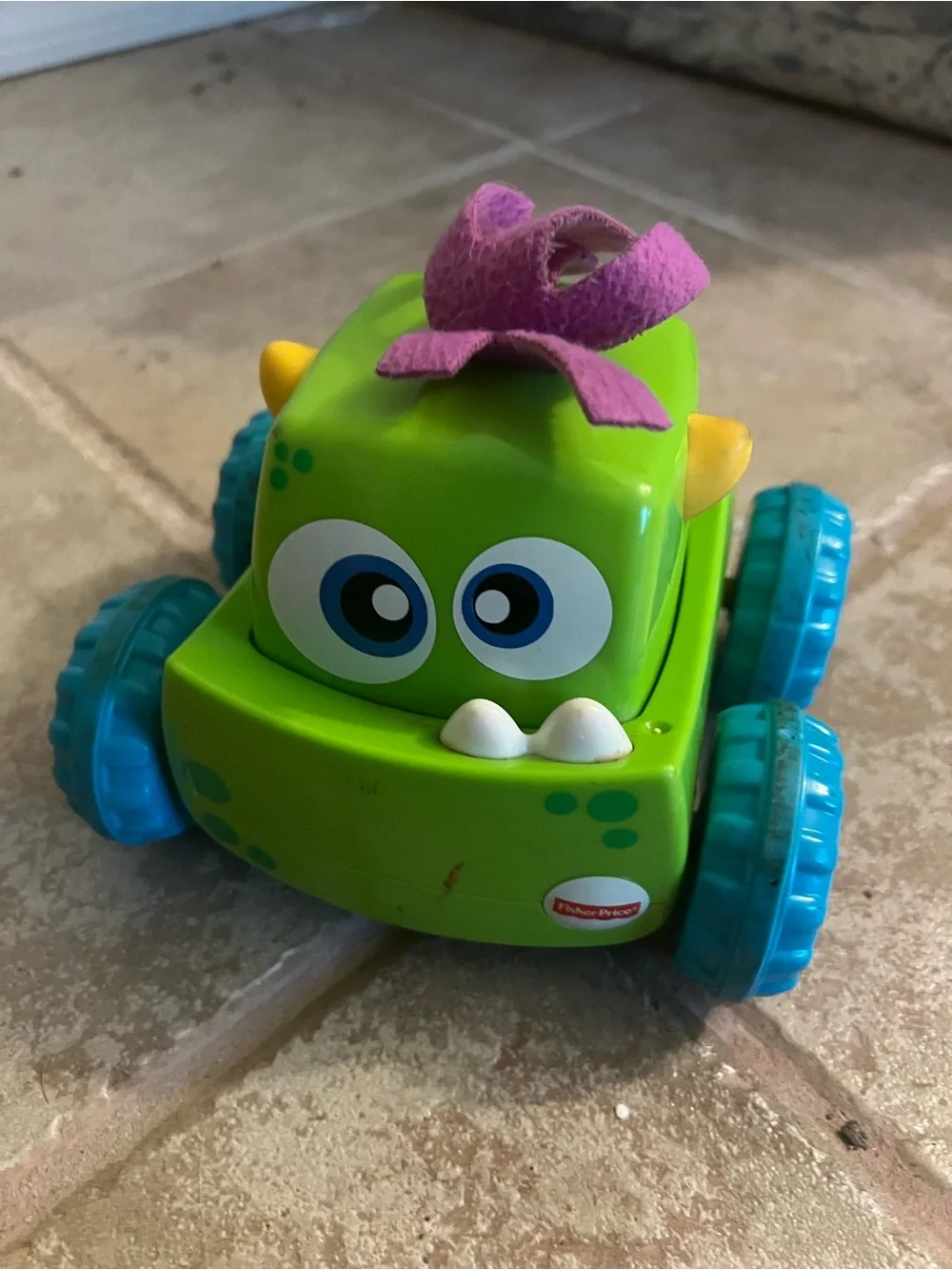 Fisher-Price Green Monster Push Car with Blue Wheels and Purple Topper